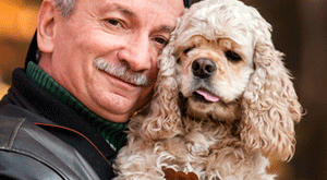 Man hugging dog